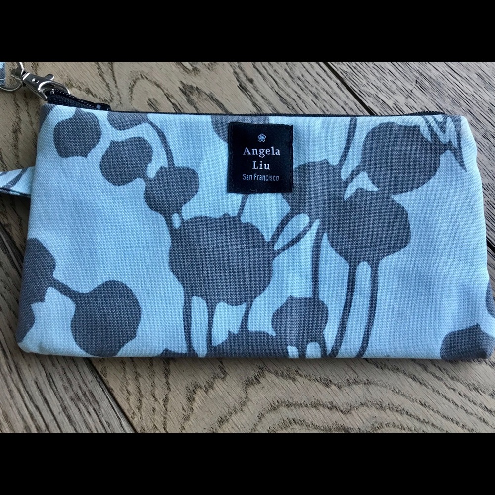 Botanic wristlet, blue with gray print. New